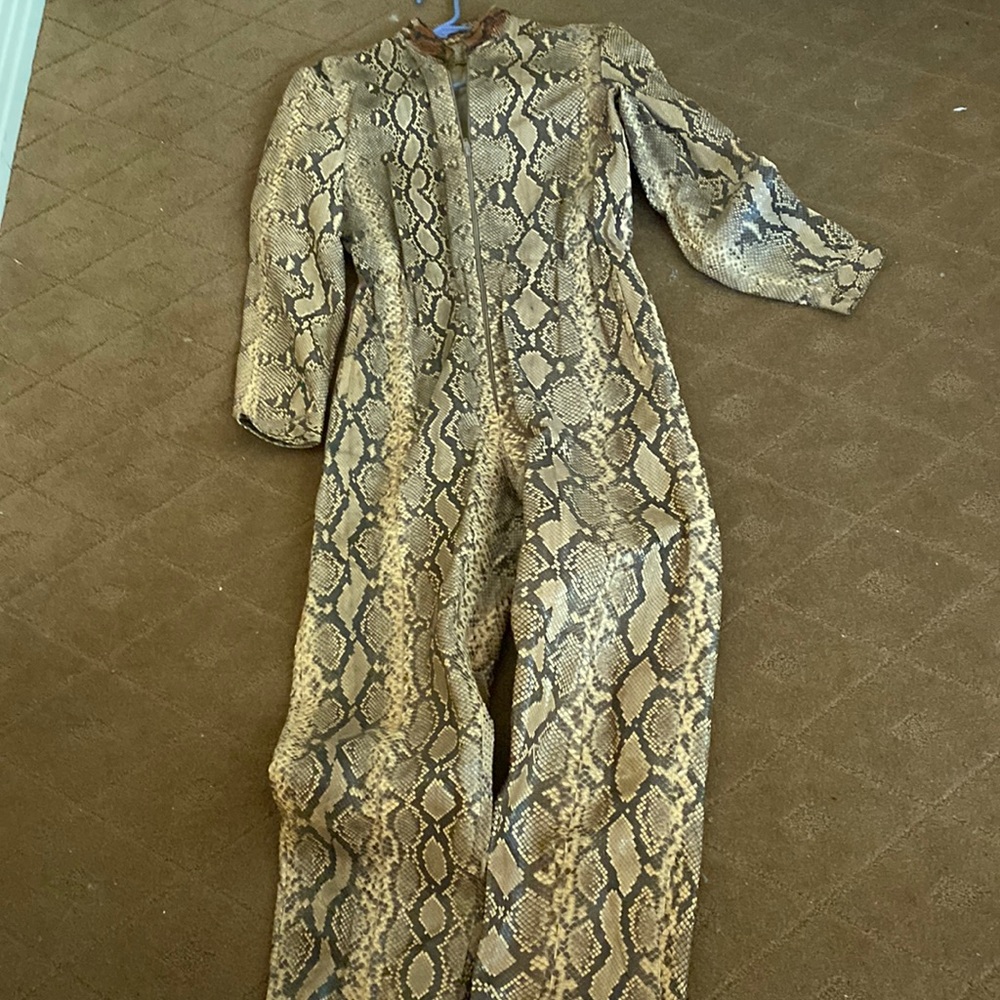 Total python Real. Jumpsuit lined  some collar discoloration